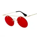 Lunettes de soleil rondes rétro tendance avec monture en métal doré léger et verres rouges vifs. - Monture Dorée Lentille Rouge Océan (C8)