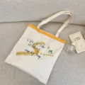 Canvas tote bag with letter print, casual shoulder bag for daily use, large capacity design. - Shoulder Bag / Off-White Shoulder
