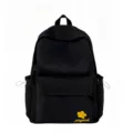 Detailed view of the black nylon backpack showing the front pocket and flower embroidery design. - Black