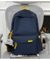 Casual solid color large capacity school backpack with cute octopus plush pendant and yellow accents. - With Pendant / Blue