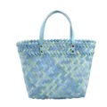 Close-up detail of the woven blue and green straw tote bag handle and textured pattern. - Teal