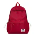 Roter Schülerrucksack Detail mit schwarzem Pünktchen- und Schleifenmuster sowie Fronttasche. - Einzelne Tasche / Rot