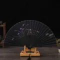 Retro silk folding fan with elegant purple floral design, perfect for dancing, qipao and gifts. - Black Bone Black Surface Orchid / Black