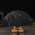 Vintage black silk folding fan with bamboo dragonfly pattern and wooden stand for decor. - Black Bone Black Surface Bamboo Dragonfly / Black