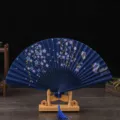 Retro dark blue silk folding fan with floral butterfly pattern and wooden display stand - Blue Bone Blue Surface Cherry Blossom Butterfly / Blue