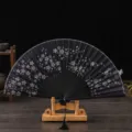 Retro black silk folding fan with cherry blossom print, elegant gift dance fan with stand. - Black Ribs & Black Fabric Cherry Blossom Fan / Black