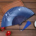 Close-up of blue gradient folding fan detail with white butterfly and matching tassel. - 09 Orchid