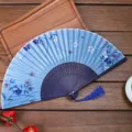 Chinese style silk folding fan with blue floral print, elegant wooden ribs and blue tassel. - Style H