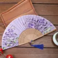 Chinese style folding silk fan with elegant purple floral pattern and tassel for daily use. - Style I