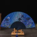 Japanese style folding fan with blue butterfly floral print, wooden ribs and tassel for dance. - No. 11 Blue Ribs & Light Blue (Lily)