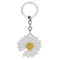 Vue détaillée du charmant porte-clés en métal marguerite, accessoire de sac tendance. - Porte-clés Marguerite Unique / Argent