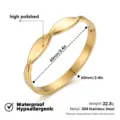 Pulsera de brazalete de acero inoxidable dorado con superficie pulida brillante y diseño abierto. - Brazalete de superficie de espejo retorcida