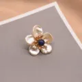 Exquisite baroque pearl flower brooch with blue center stone and sparkling zircon accents. - Lapis Lazuli