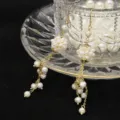 Elegant freshwater pearl tassel earrings, handmade long floral design, beautiful jewelry gift. - Pearl Ball Tassel Earrings