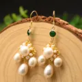 Handmade freshwater pearl drop earrings with green crystal and gold metal flower design variant. - Emerald Green Tassel Earrings