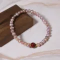 Pink freshwater pearl bracelet with red center bead and gold accents for women daily wear - Cinnabar Elastic Bracelet