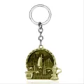 Close-up detail of the metal Dubai landmark keychain with camel and coffee pot design. - G-1048 / Bronze