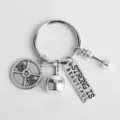 Detailed close-up of fitness theme metal keychain with barbell plate and dumbbell charms. - G-404