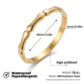 Detalle de la pulsera rígida de acero inoxidable dorada con acabado muy pulido. - Brazalete rígido de bambú