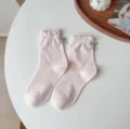 Graziosi calzini rosa a volant a metà tubo con fiocco grigio per donne cotone comodo - Taglia unica / Rosa chiaro