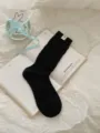 Calze a tubo in maglia nera con etichetta in tessuto, perfette per l'uso quotidiano. - Taglia unica / Nero