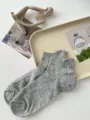 Comfortable gray women's short socks with subtle ribbed knit texture and cute pink cuffs. - One Size / Light Gray