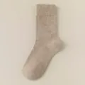 Close-up detail of cozy winter wool blend mid-tube sock in solid oatmeal color warm comfy - Khaki