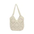 Detailed view of handmade crochet shoulder tote bag with vintage geometric pattern in beige color. - White