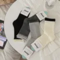 Calzini donna tubo medio colore unito risvolto arrotolato calze casual autunno 4 paia - Taglia unica / Nero
