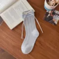 Grey cotton slouch socks for women featuring blue trim and cute white ribbon bow detail. - One Size / Oatmeal