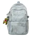 Light blue nylon backpack with cute dinosaur pendant, large capacity school bookbag for teens. - Blue