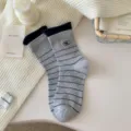 Grey striped cotton mid-tube socks with navy blue cuffs and cute egg embroidery for women. - Gray