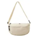 Detail view of the casual canvas crescent sling bag, featuring smooth black zippers and strap. - Off White