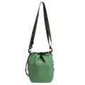 Detailed view of the green grid nylon drawstring bucket bag with black strap for travel. - Green