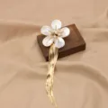 Elegant mother of pearl flower brooch with long gold fringe tassel, stylish fashion jewelry. - Shell Flower Tassel Pearl Brooch