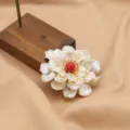 Elegant baroque pearl flower brooch with red center stone, premium fashion jewelry. - Three-Layer Petal and Pearl Brooch with Red Stone Center