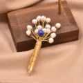 Elegant wire-wrapped pearl flower brooch with blue center stone for women fashion jewelry. - Dark Blue Pearl Bouquet Brooch