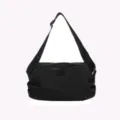 Black nylon crossbody bag detail, casual shoulder bag with smooth zipper closure. - Black