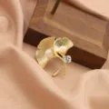 Exquisite matte gold ginkgo leaf brooch featuring freshwater pearls and brilliant zirconia. - Style 1