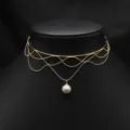 Elegant multi-strand gold choker necklace featuring delicate wave chains and a pearl pendant. - White Edison Tassel Choker
