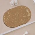 Detailed view of the oval brown floor mat with white speckles and Good Luck text in bathroom setup. - Korean Style Simple-5