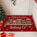 Detail shot of the Christmas red doormat featuring cute gingerbread train pattern for festive home decor. - Christmas-6