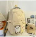 Beige canvas ita backpack detail view featuring a clear display pocket and cute cat plush. - With Pendant / Yellow