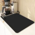 Black coffee maker mat detail, absorbent kitchen countertop drying pad and heat insulation pad. - Black