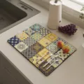 Mediterranean bohemian tile pattern kitchen drying mat on countertop with cutlery and fruits - Green Shadow Maze