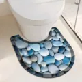 Vue détaillée d'un tapis de toilettes en U avec motif de galets bleus réalistes. - Forme en U 40x60 cm / Galets - 2