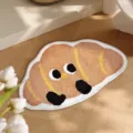 Macro detail view of a cute cartoon croissant-shaped plush non-slip floor mat for home - Animal Paradise-8