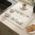 Diatomaceous earth kitchen drying mat with elegant floral design for fast water absorption. - Garden Realm