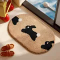 Cute oval faux cashmere bath mat featuring a cartoon black rabbit pattern in camel color - Animal Paradise-14