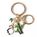Close-up of cute panda and bamboo charms on a gold-toned Chinese style keychain. - G-1522 -1